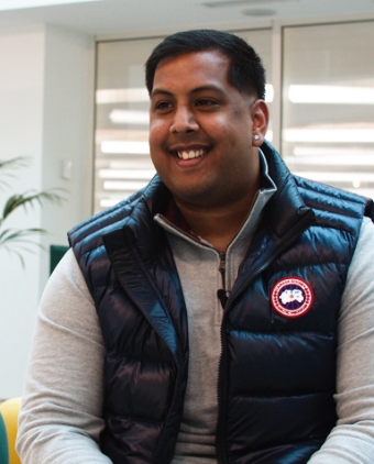 A man smiling in the cinch office